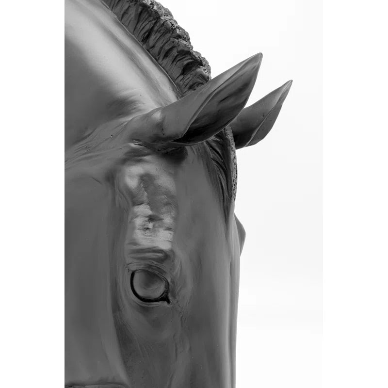 The artificial stone sculpture gives the impression that it could neigh at any moment, especially after indulging in the gently undulating water. It's not just equestrians who find themselves instinctively reaching out to stroke the noble black horse's he
