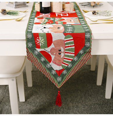 Christmas-themed table runner with Santa Claus design on a dining table.