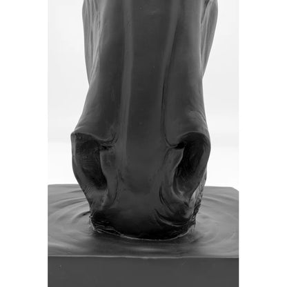 The artificial stone sculpture gives the impression that it could neigh at any moment, especially after indulging in the gently undulating water. It's not just equestrians who find themselves instinctively reaching out to stroke the noble black horse's he