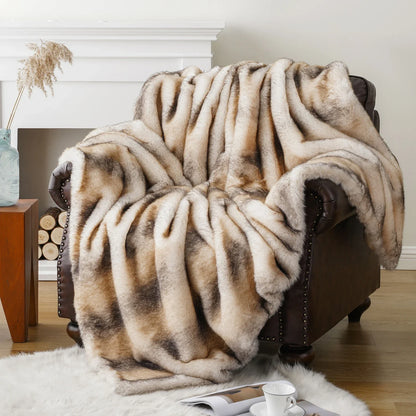 Fluffy beige blanket draped over a brown armchair in a cozy living room.